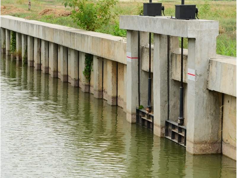 Stoplogs installed in a hydraulic structure to control water flow and maintain water levels